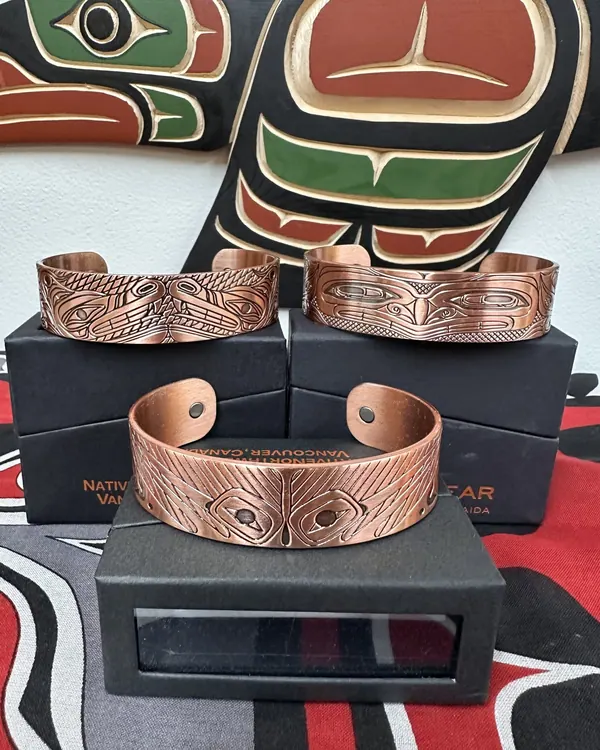 Copper cuffs with Indigenous designs