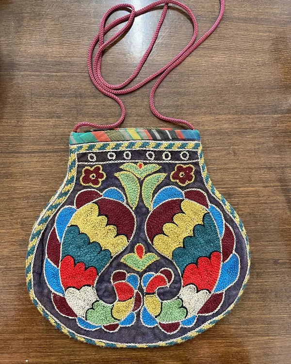 Hand-beaded handbag with a floral motif