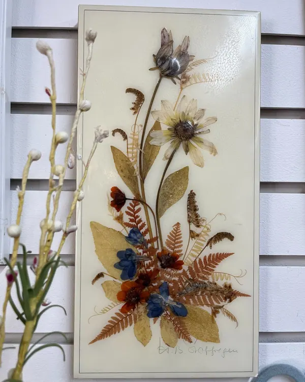 Pressed flowers set in resin