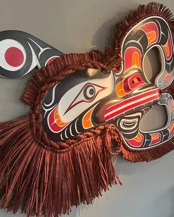 Carved and painted Northwest Coast mask with fringe