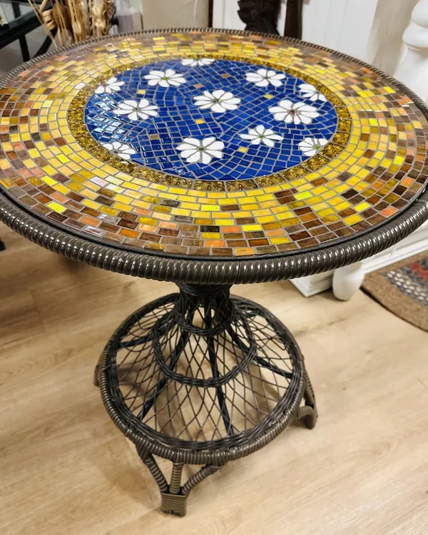 Bistro table with a yellow and blue mosaic top