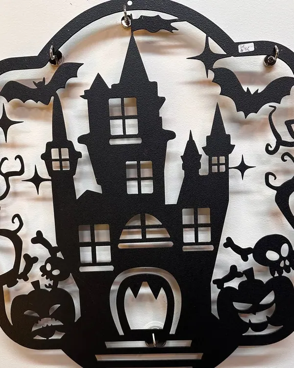 Cut metal haunted house wall art