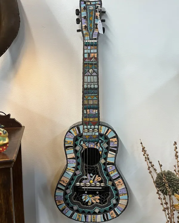 Guitar covered in mosaic tiles
