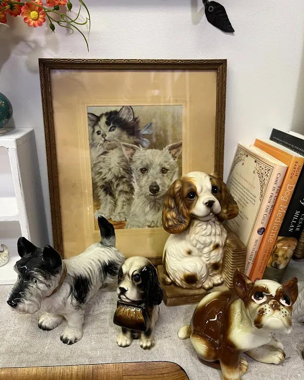 Porcelain dog figurines and a framed print