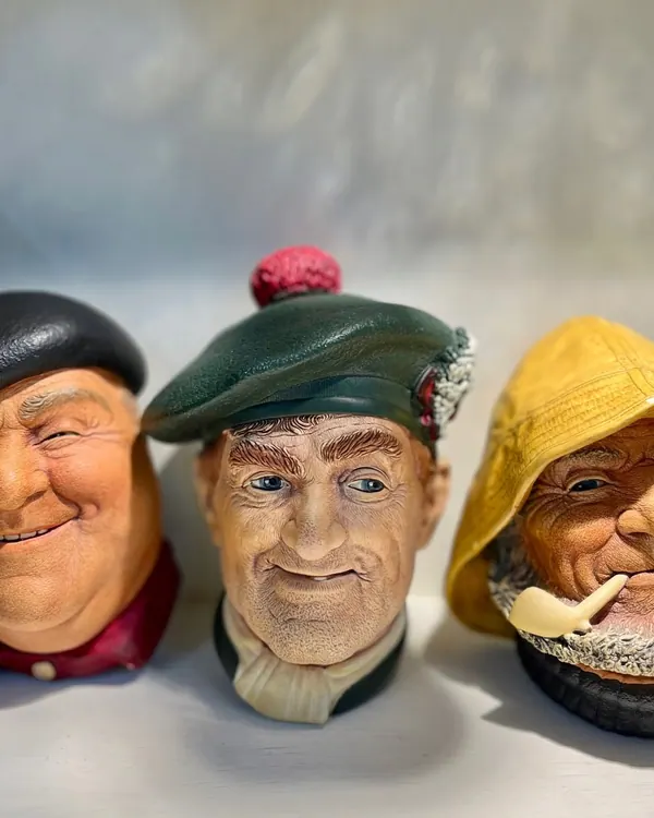 Three character head jugs